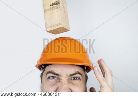 Safety Helmet. Brick And A Board Fall On Builder Head. Saving A Life Due To Wearing A Protective Con