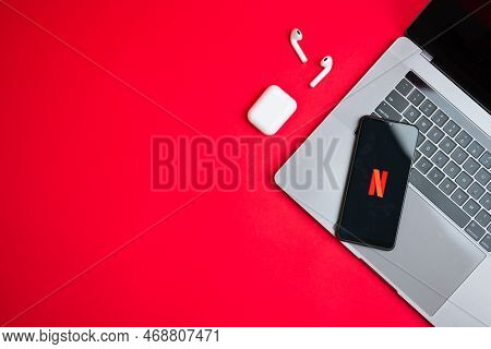 Tula, Russia - November 19, 2021: Logo Onlyfans Displayed On A Smartphone Near Modern Laptop On Red 
