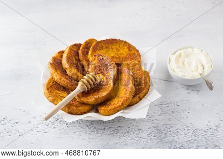 Sweet Pumpkin Toast With Honey And Cream, Sprinkled With Powdered Sugaron A Light Blue Textured Back