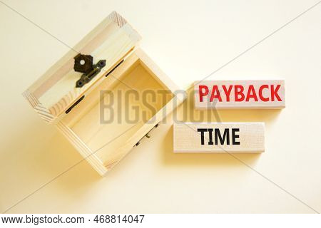 Payback Time Symbol. Concept Words Payback Time On Wooden Blocks. Beautiful White Table White Backgr