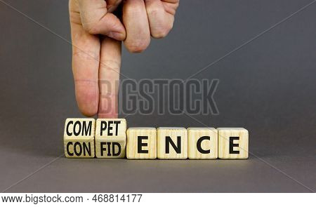 Competence And Confidence Symbol. Concept Word Competence Confidence On Wooden Cubes. Businessman Ha