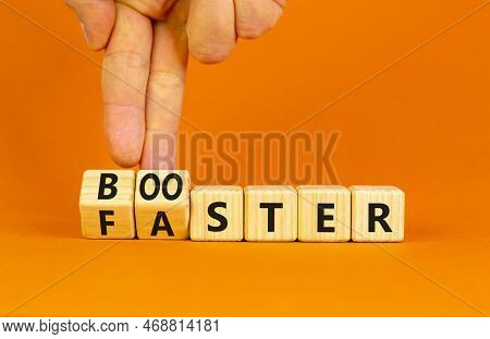 Booster And Faster Symbol. Concept Word Booster Faster On Wooden Cubes. Businessman Hand. Beautiful 