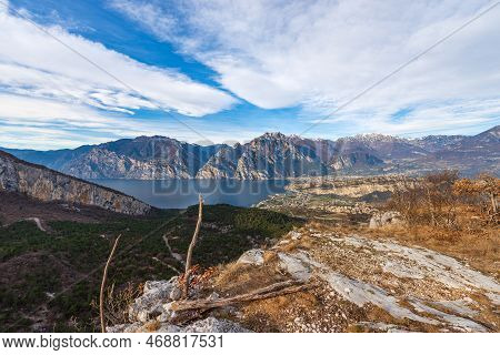 Aerial View Of Lake Garda With The Alps, Dolomites And Sarca Valley, View From The Mountain Range Of