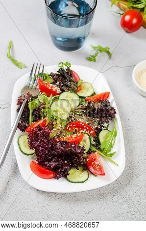 Healthy Vegetable Salad With Fresh Salad Leaves, Arugula, Cherry Tomato, Cucomber And Parsley In Pla