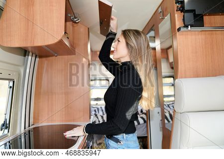 Slim Beautiful Woman Living In Camper Van Motor Rv Home Interior Lifestyle In Vanlife
