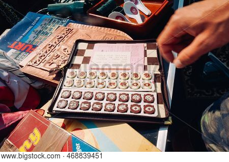 Frankfurt, Germany - August 23, 2015 : Pose Of An Interesting Chess Pieces Exposed Between Books In 