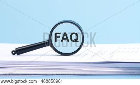 Magnifying Glass With Faq - Frequently Asked Question, Inscription On A Blue Background.