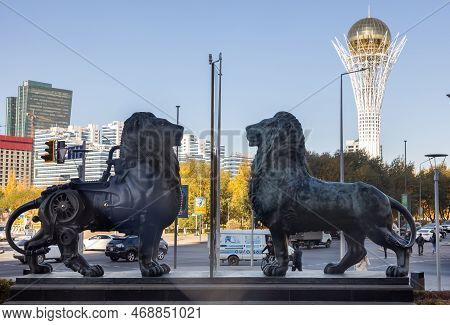 October 15, 2022 Astana, Republic Of Kazakhstan: Sculpture Of Two Lions Against The Background Of Th