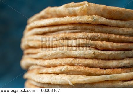 Flatbread Lavash, Chapati, Naan, Heap Of Tortilla On A Blue Background Homemade Flatbread Stacked.