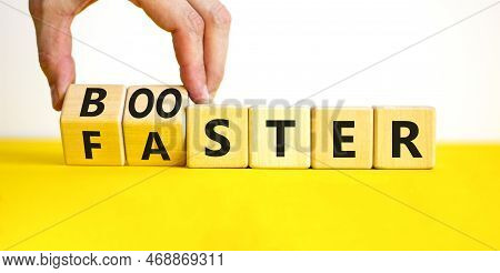 Booster And Faster Symbol. Concept Word Booster Faster On Wooden Cubes. Businessman Hand. Beautiful 