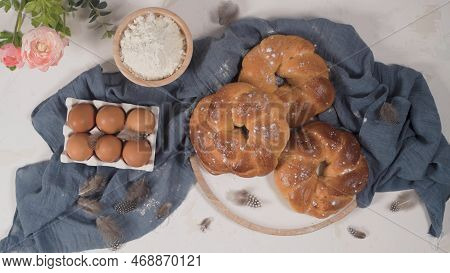 Easter Folar And Eggs On Wooden Table Top.