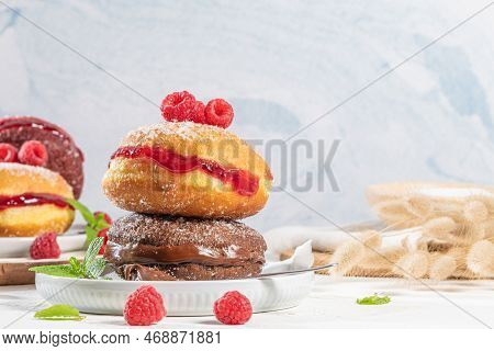 Bolas De Berlim, Or Berlin Balls. Portuguese Fried Dough With Sugar, Filled With Chocolate Or Raspbe
