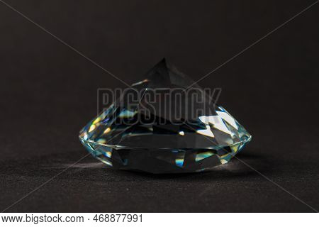 Beautiful Dazzling Diamond On Dark Background, Closeup. Precious Gemstone
