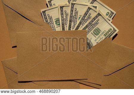Dollar Banknote Saving Money In Envelope On Beige Background Copy Space. Consumption And Economy Col