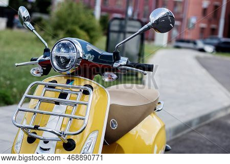 Minsk, Belarus, January 2023 - Classic Italian Moped Vespa Yellow. Urban Vintage Transport