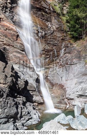 Foaming Jets Of Mountain Alpine Lillaz Waterfall (cascate Di Lillaz) Rush Down Granite Rapids To Lit