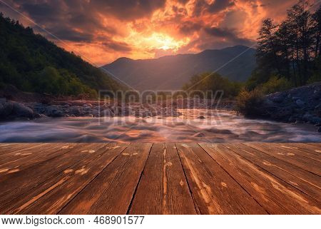Fast Mountain River Flowing With Empty Wooden Batten Bridge. Natural Template Landscape.