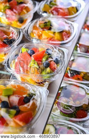 Boxes With Pre-packaged Fruit Salads In A Commercial Fridge