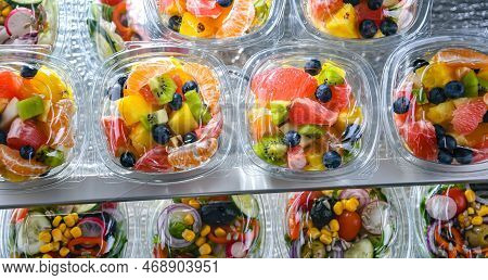 Boxes With Pre-packaged Fruit Salads In A Commercial Fridge