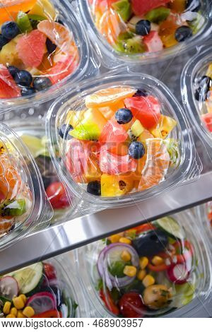 Boxes With Pre-packaged Fruit Salads In A Commercial Fridge