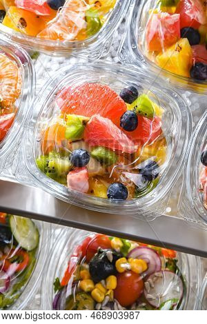Boxes With Pre-packaged Fruit Salads In A Commercial Fridge