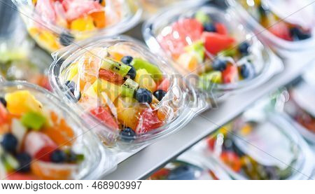 Boxes With Pre-packaged Fruit Salads In A Commercial Fridge