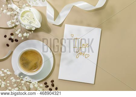 Valentines Day Flat Lay With Cup Of Natural Coffee, Creamer With Milk, Coffee Beans And Gift Card Wi