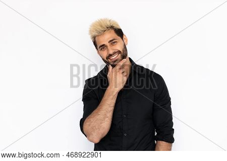 Playful Young Man Holding His Chin. Male Caucasian Model With Brown Eyes, Ombre Painted Hair And Bea