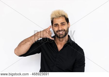 Portrait Of Playful Young Man Making Phone Gesture. Male Caucasian Model With Brown Eyes, Ombre Pain