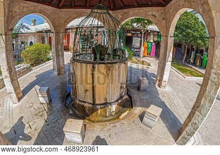 Mostar, Bosnia And Herzegovina - Aug 15, 2022: Fountain-sadirvan Inside In The Courtyard Of The Mosq
