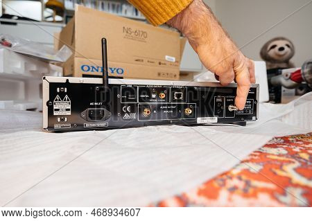 Paris, France - Dec 13, 2022: Pov Male Hand Pointing To Dab Radio Antenna Conneciton On New Onkyo Ns