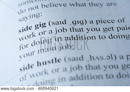 A Mock Up Of A Dictionary Page With The Word Side Gig With Selective Focussing