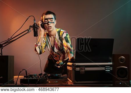 Happy Musician Playing With Techno Music On Mixer, Having Fun With Turntables As Disc Jockey And Mix