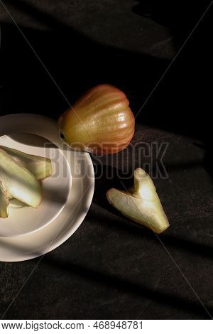 Rose Apple Or Jambu On Dark Background Under Sunlight. Thailand Apple Tropical Fruit Flavors Of Swee