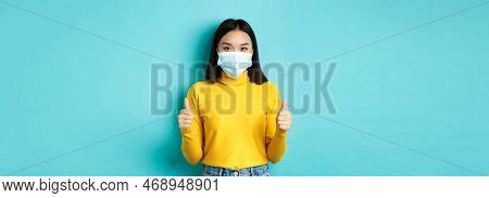 Covid-19, Social Distancing And Pandemic Concept. Supportive Asian Woman Recommend Promotion, Wearin