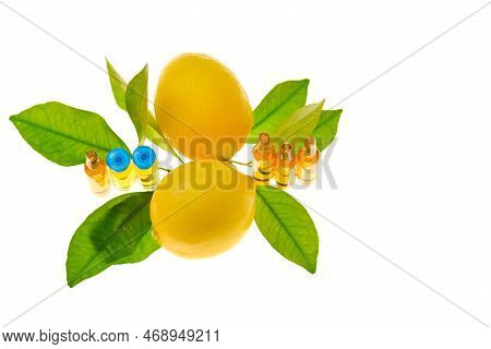 Vitamin C Glass Ampoules.solution Of Vitamin C, Lemons Fruits With Leaves On A White Background .inj
