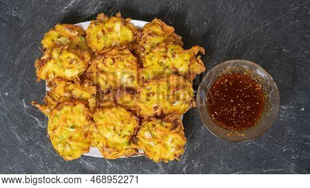 Bakwan Is A Fried Food Made From Vegetables And Flour That Is Commonly Found In Indonesia. Served Wi