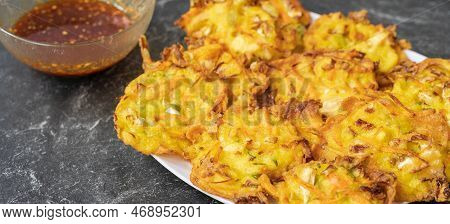 Bakwan Is A Fried Food Made From Vegetables And Flour That Is Commonly Found In Indonesia. Served Wi