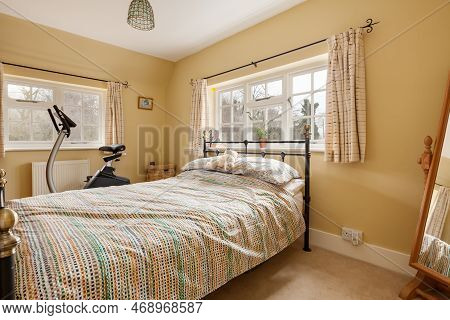 Kennett, Suffolk, England - March 1 2019: Traditional Furnished Cottage Bedroom With Exercise Bike A