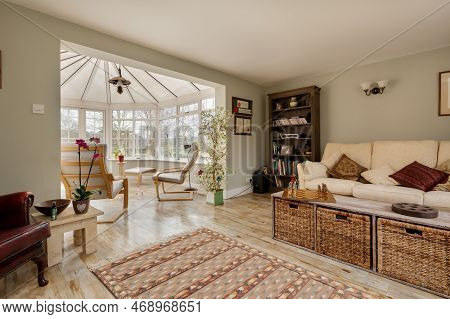 Kennett, Suffolk, England - March 1 2019: Furnished Living Room With Opening Through To Upvc Conserv
