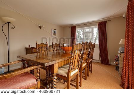 Kennett, Suffolk, England - March 1 2019: Dining Room Furnished With Traditional Wooden Table And Ch