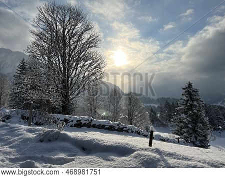 Icy Winter Sun Over A Fresh Snow Cover In The Swiss Alps And In The Amden Winter Resort Area Above T
