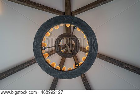 Medieval Style Chandelier Glows Bright While Hanging Over Head