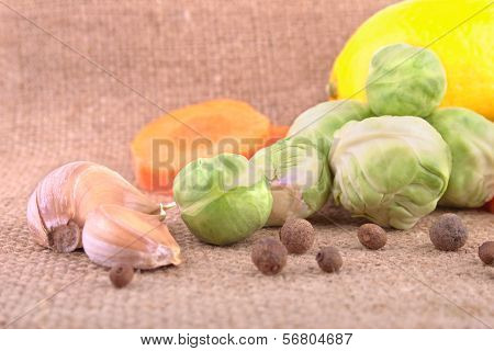 Brussels Sprout, Garlic, Carot And Lemon In  Heap