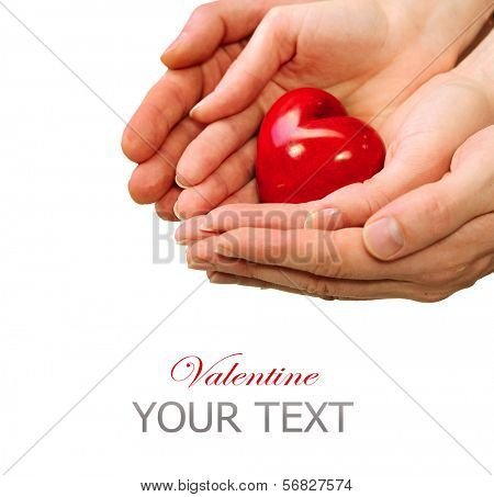 Valentine Heart in Man and Woman Hands isolated on white Background. Love and Relationships Concept. Valentines Day Postcard Art Design. Couple Taking Red Heart in their Hand. Valentines Day 