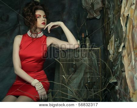 elegant sensual young woman in red dress