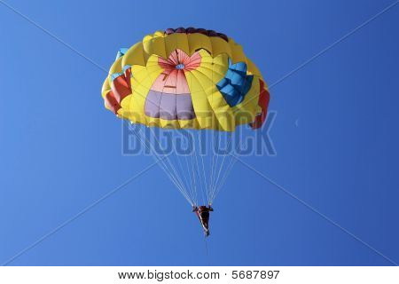 Man Parasailing (in sky with crescent)
