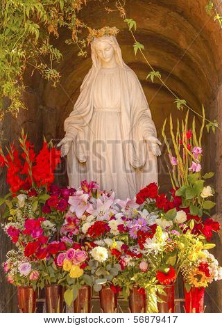 Virgin Mary Statue with Flowers Garden Mission San Buenaventura Ventura California