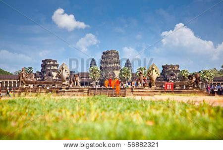 ANGKOR WAT, CAMBODIA - NOV 20, 2013. Buddhist monks in Angkor Wat on Nov 20, 2013, Cambodia. Angkor Wat was first a Hindu, then subsequently, a Buddhist temple complex in Cambodia .