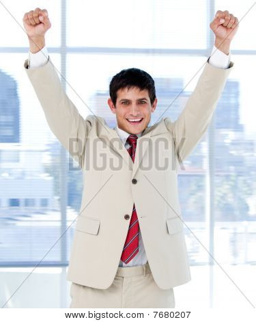 Cheerful Businessman Punching The Air In Celebration